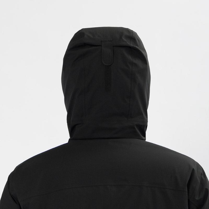 Montbell Men's Aspen Down Half-Length Coat in Black, showcasing its sleek, waterproof urban design.