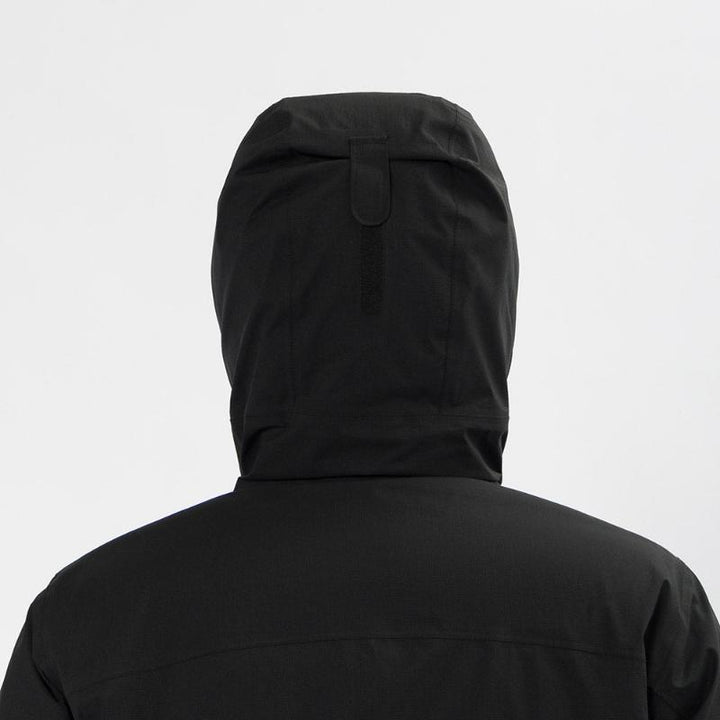 Montbell Men's Aspen Down Half-Length Coat in Black, showcasing its sleek, waterproof urban design.