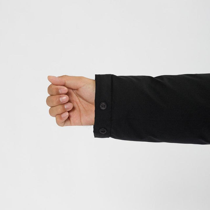Montbell Men's Aspen Down Half-Length Coat in Black, showcasing its sleek, waterproof urban design.