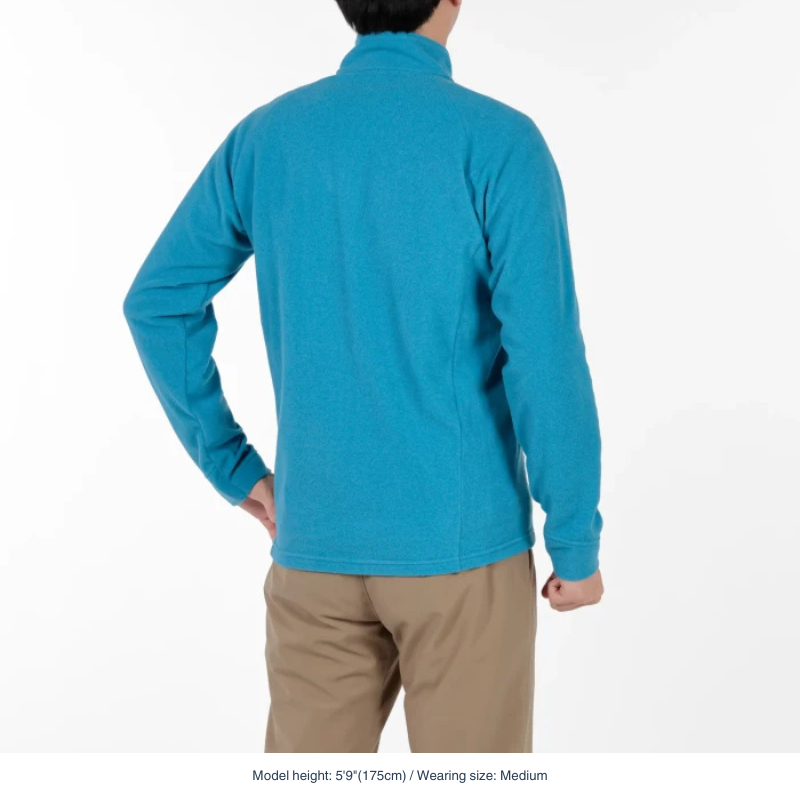 Montbell Men's Fleece Jacket in blue model, showcasing its clean lines and comfortable, easy-wear fit.