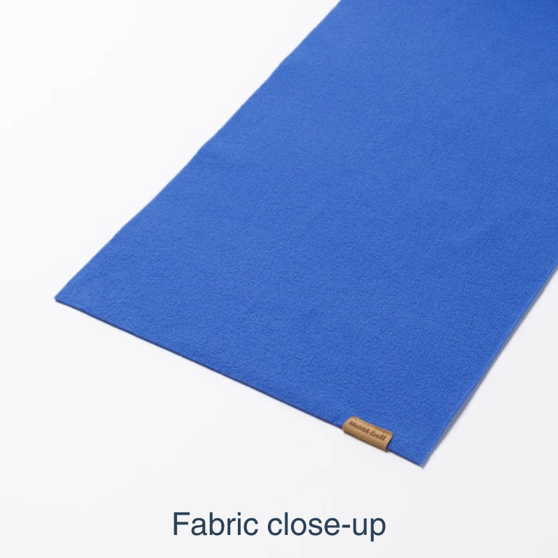 A close-up of a vibrant blue fabric, shown folded diagonally on a white background with the text 'Fabric close-up' at the bottom.