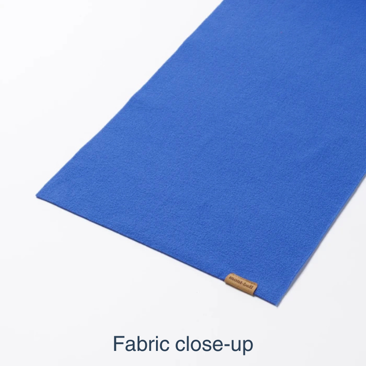 A close-up of a vibrant blue fabric, shown folded diagonally on a white background with the text 'Fabric close-up' at the bottom.
