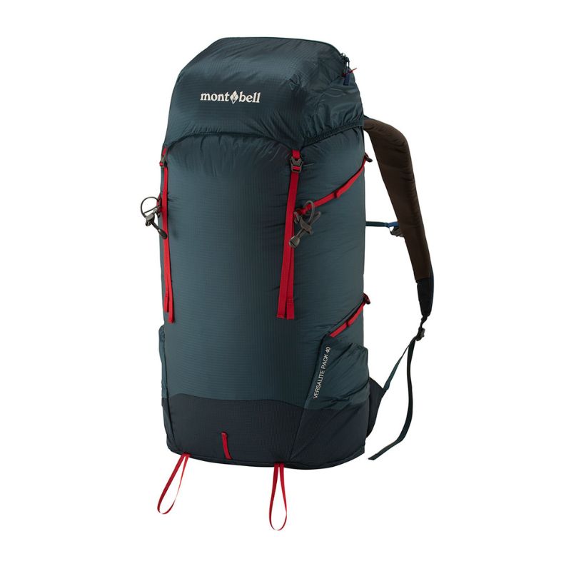 A Montbell backpack with a blue body, red straps, and red detailing. It features multiple pockets and a hydration bladder.