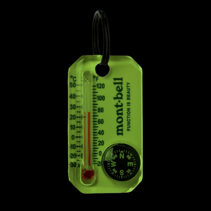 Montbell Luma Gage keychain showcasing the dual thermometer and compass design with the Montbell logo.