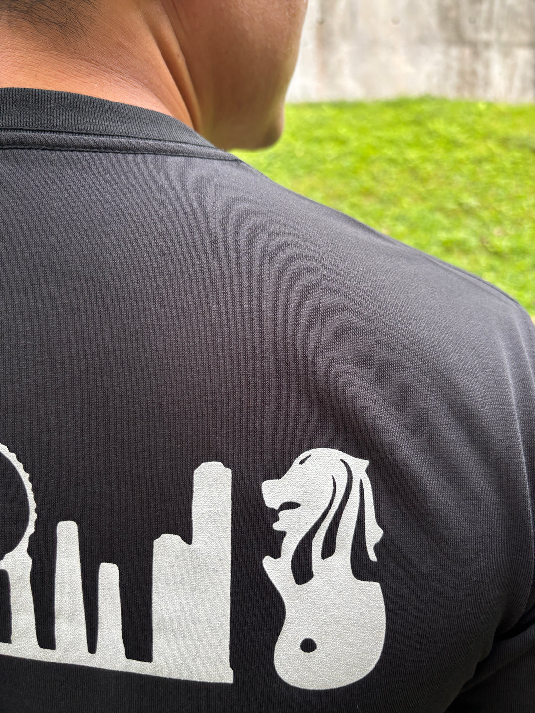 Black Montbell Singapore Icon Wickron T-shirt with white Singapore skyline graphic on the back.