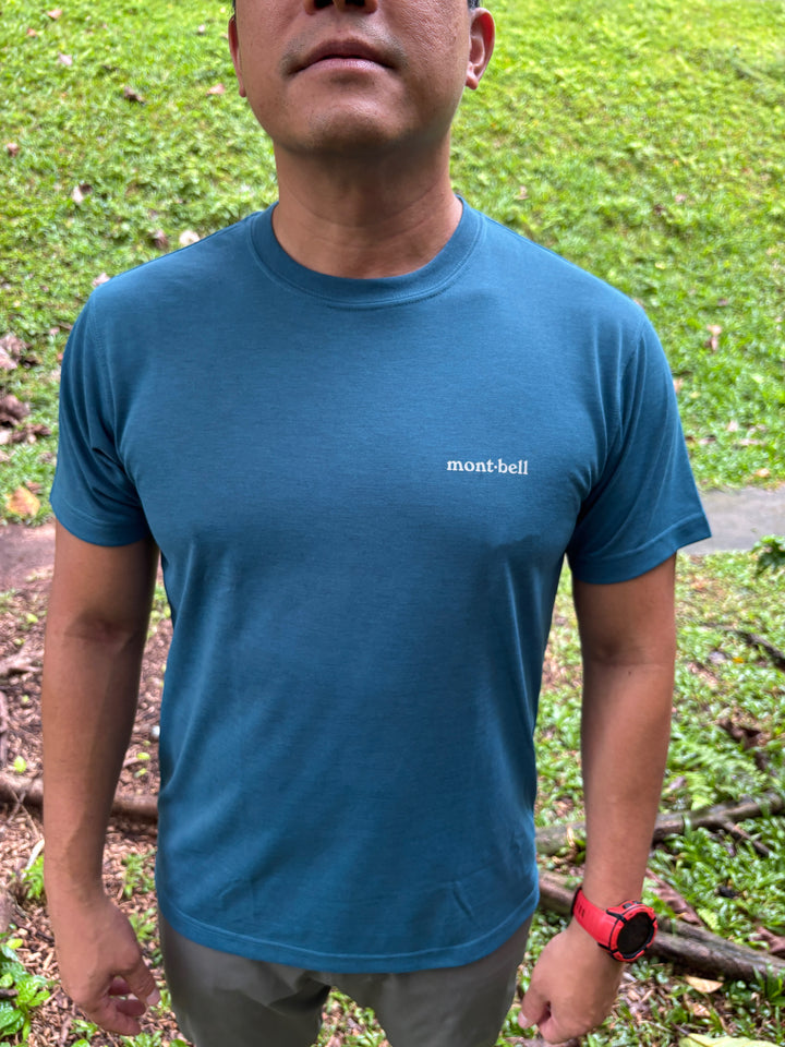blue-green Montbell Singapore Icon Wickron T-shirt with white Singapore skyline graphic on the back.
