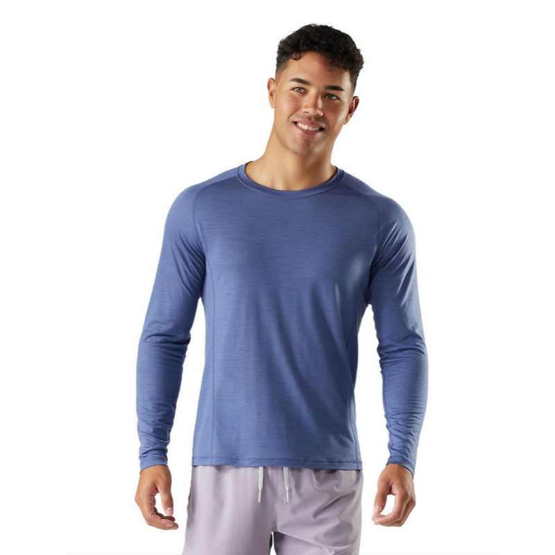 Smartwool Men's Active Ultralite Long Sleeve Tee (SW016546) model in nightfall blue. A lightweight, breathable merino wool blend t-shirt designed for active outdoor performance.