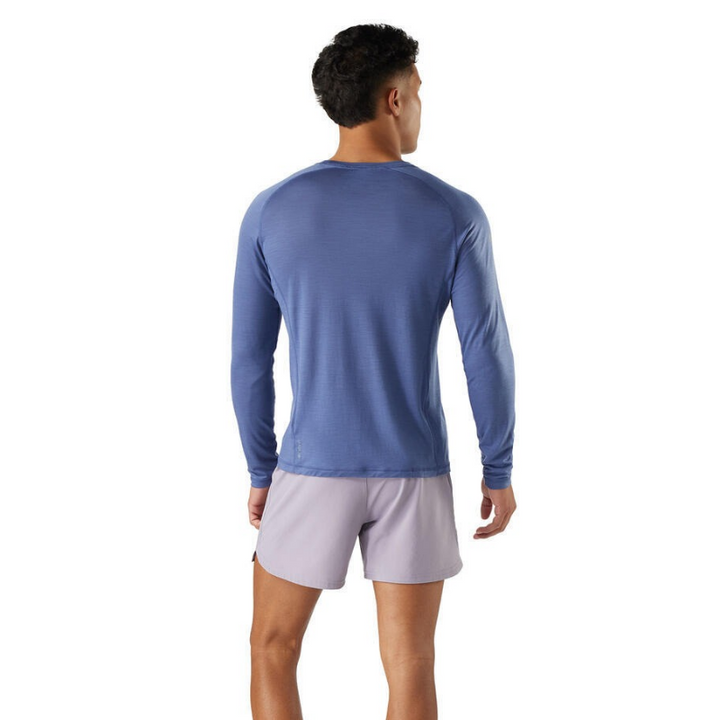 Smartwool Men's Active Ultralite Long Sleeve Tee (SW016546) model in nightfall blue back view. A lightweight, breathable merino wool blend t-shirt designed for active outdoor performance.