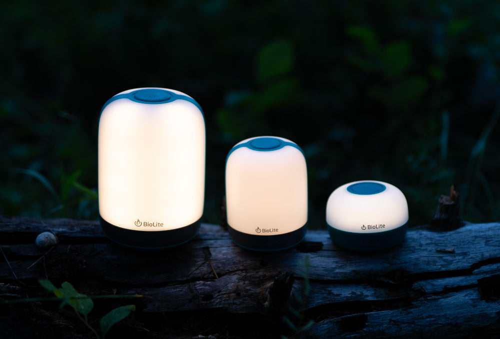 BioLite AlpenGlow lanterns on a log at night