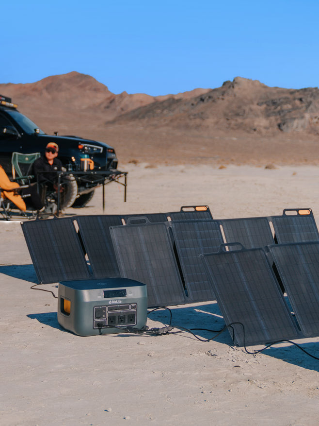BioLite BaseCharge power station with solar panels at a desert campsite