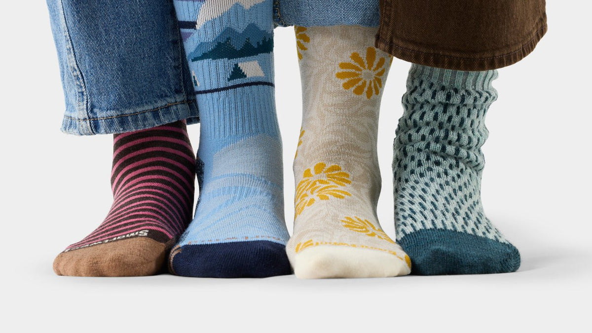 Four pairs of patterned Smartwool merino crew socks