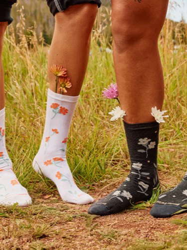 Hikers wearing Smartwool crew socks on a trail